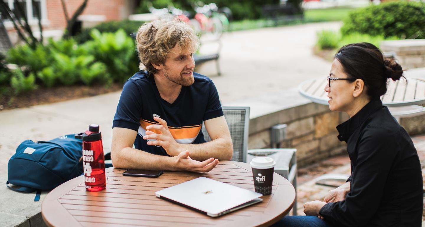 student and professor talking