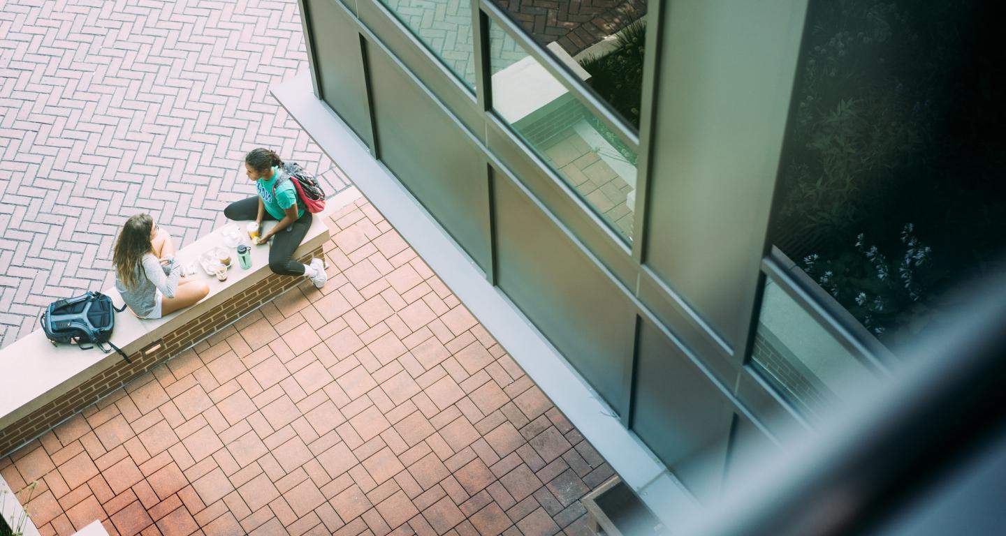 students sitting on campus